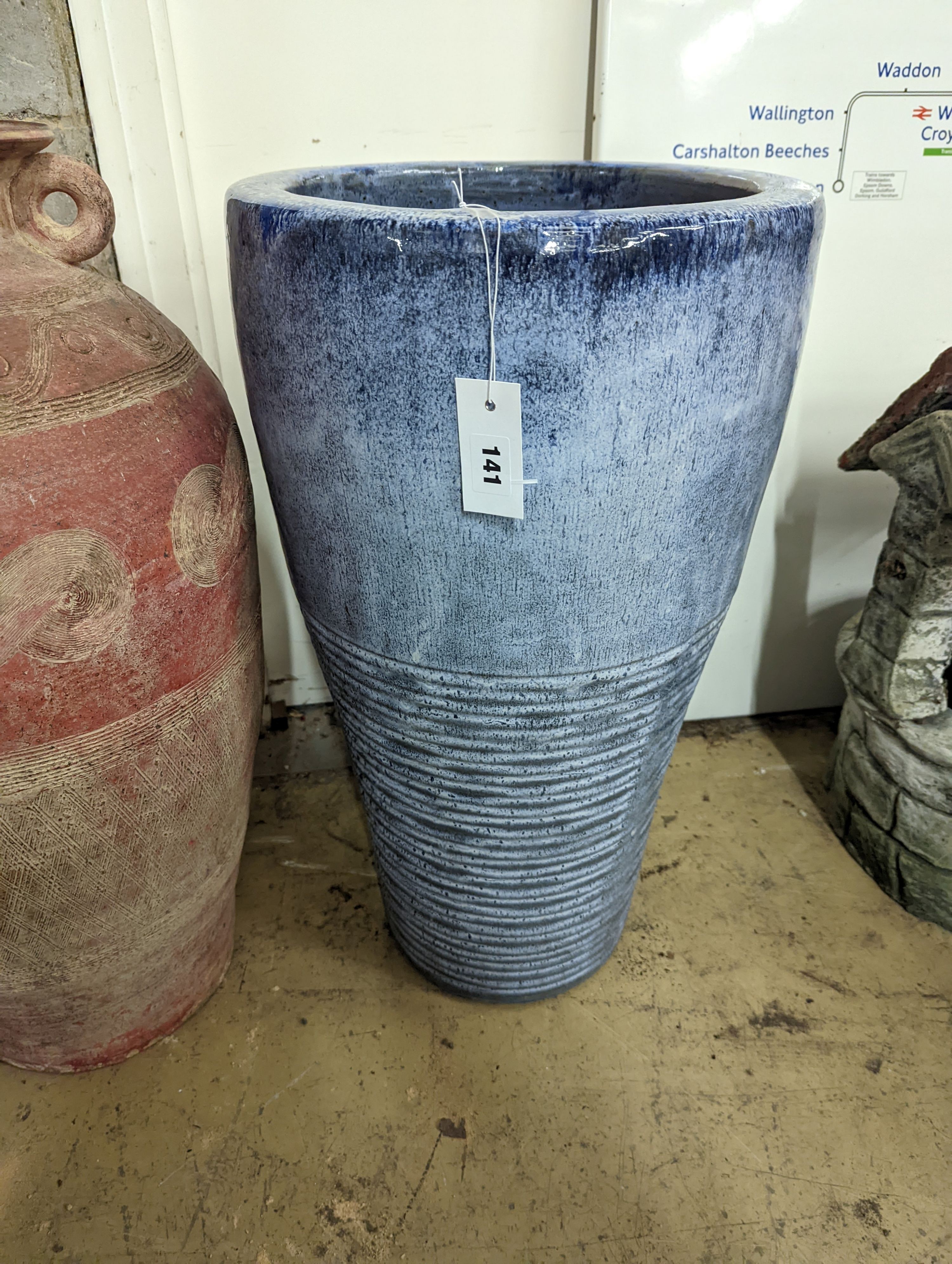 Two glazed earthenware garden planters, largest height 66cm